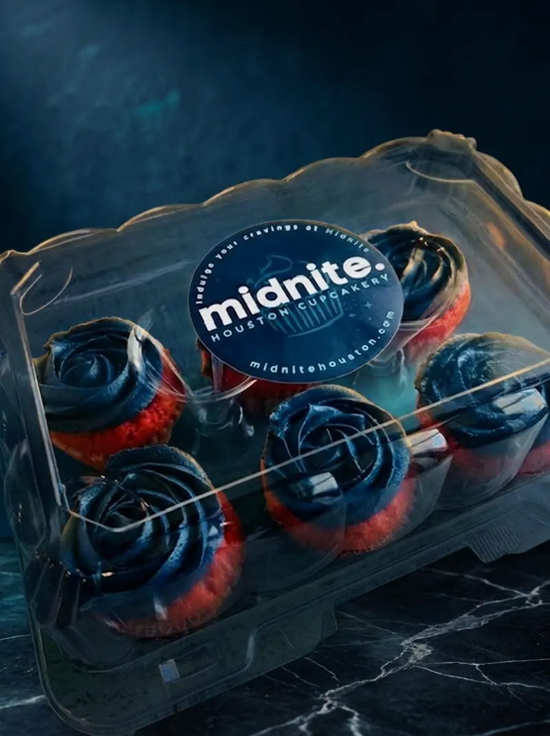 Box of Midnite's signature navy-swirl cupcakes